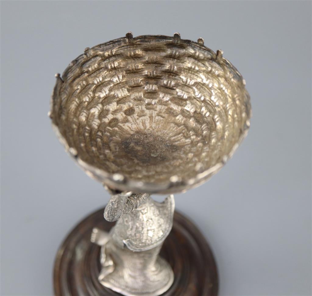 A 19th century Burmese engraved silver figural table salt,